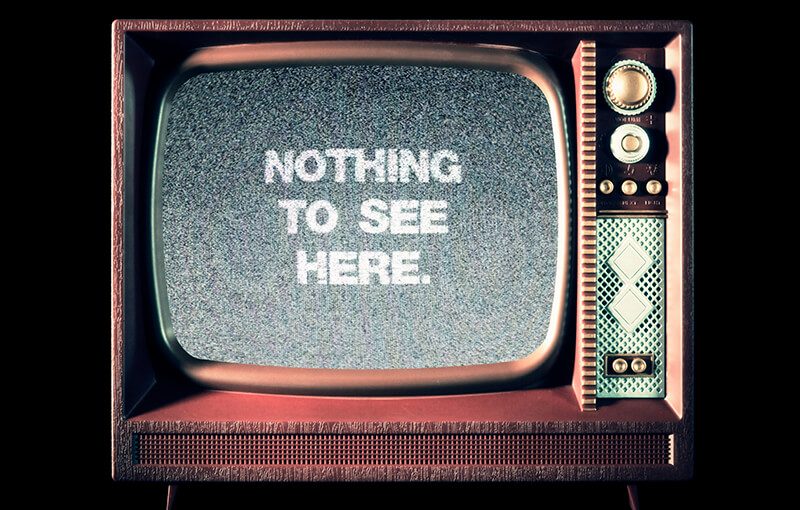 A staticky vintage television with dials, displaying the message “Nothing to see here.”