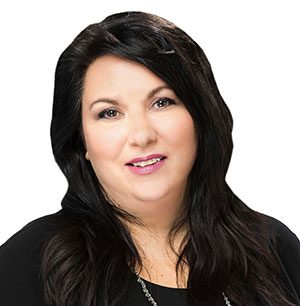 Jen - Happy woman with shoulder-length dark hair in a black blouse.