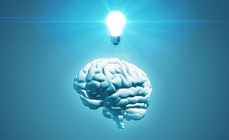 3D render of a white brain on a solid blue background, with a glowing lightbulb floating above.